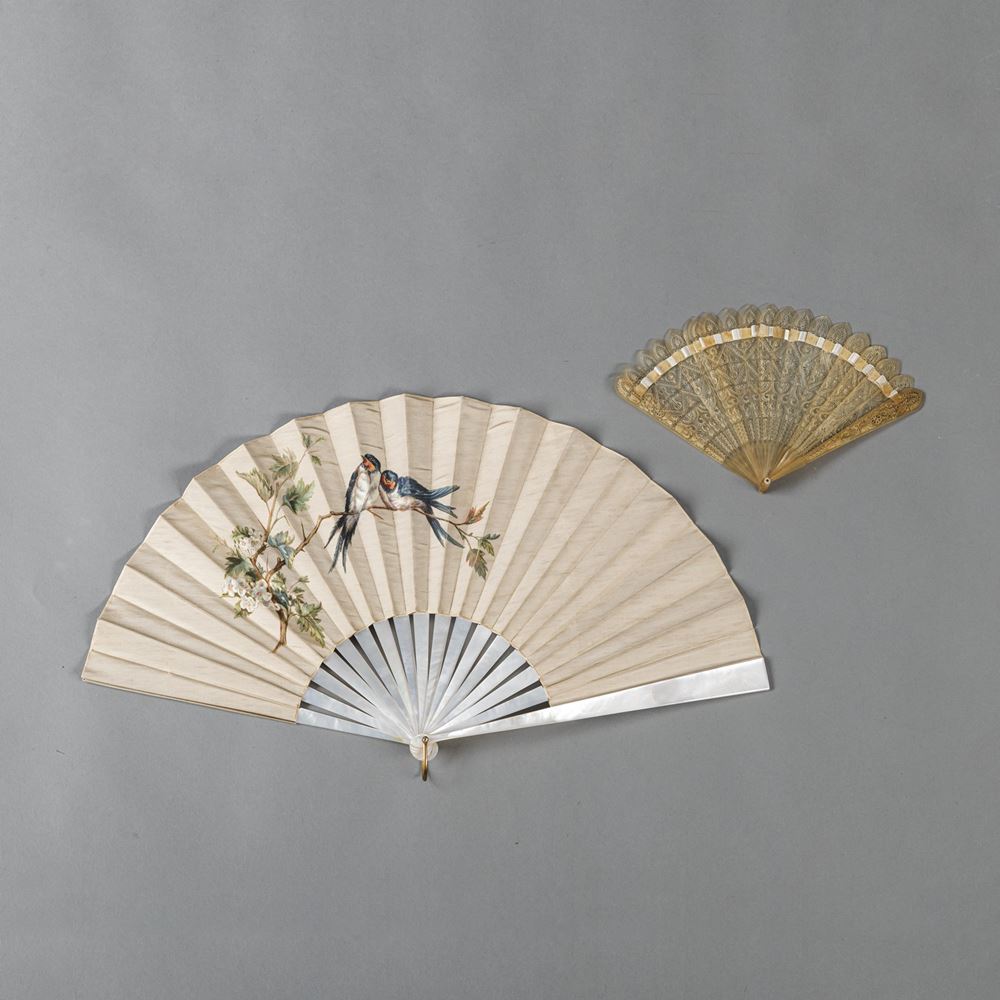 <b>TWO MOTHER OF PEARL AND HORN FANS WITH OPENWORK AND PAINTED SILK DECORATION</b>