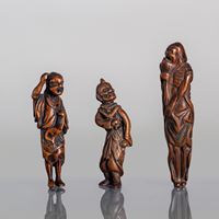 <b>A GROUP OF THREE CARVED WOOD NETSUKE OF SENNIN</b>