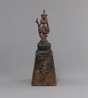 <b>AN INSCRIBED IRON WEIGHT WITH A BODHISATTVA AS A HANDLE</b>