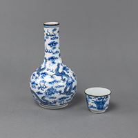 <b>A BLUE AND WHITE PORCELAIN DRAGON VASE AND A SMALL CUP</b>