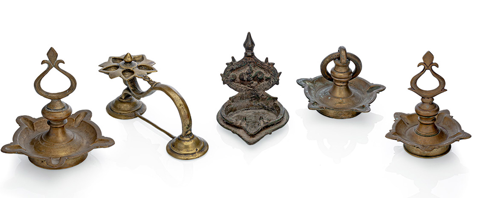 <b>A GROUP OF FIVE BRONE AND  BRASS OIL LAMPS</b>
