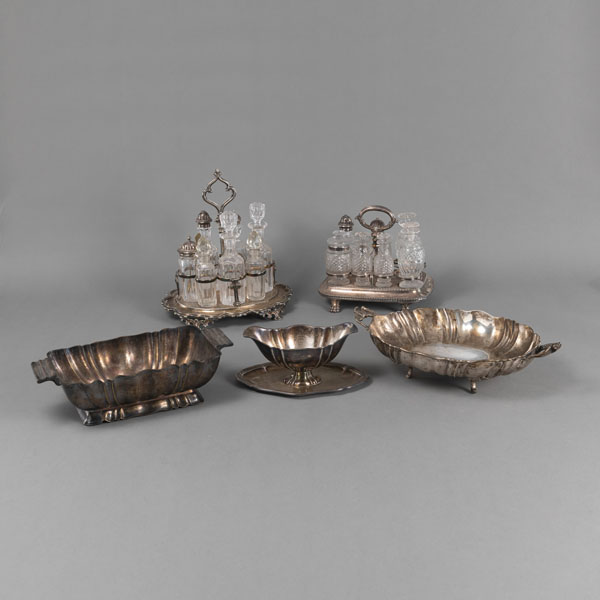 <b>TWO CRUET STANDS WITH GLASS BOTTLES, A SAUCE BOAT AND TWO BOWLS</b>