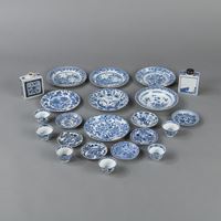 <b>A GROUP OF 23 BLUE AND WHITE PORCELAIN DISHES, SAUCERS, CUPS, AND TEA CADDIES</b>