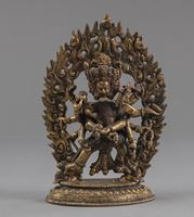 <b>A GILT-BRONZE FIGURE OF A TANTRIC DEITY ON AN INSCRIBED BASE</b>