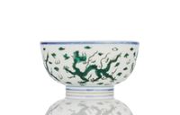 <b>A GREEN DRAGON ON STYLIZED WAVES PORCELAIN BOWL</b>