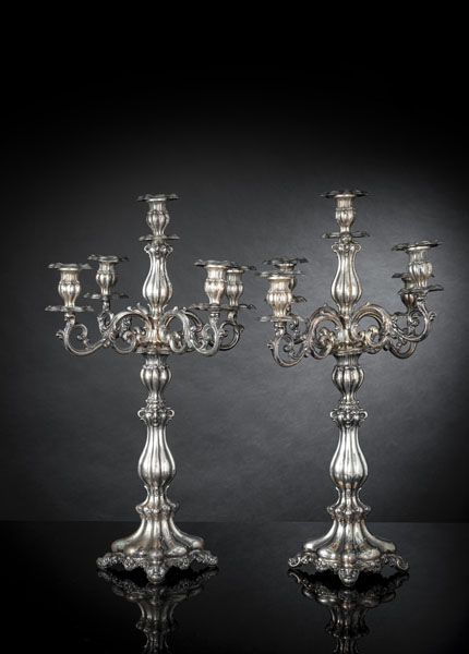 <b>A PAIR OF BAROQUE STYLE FIVE LIGHT SILVER CANDLESTICKS</b>