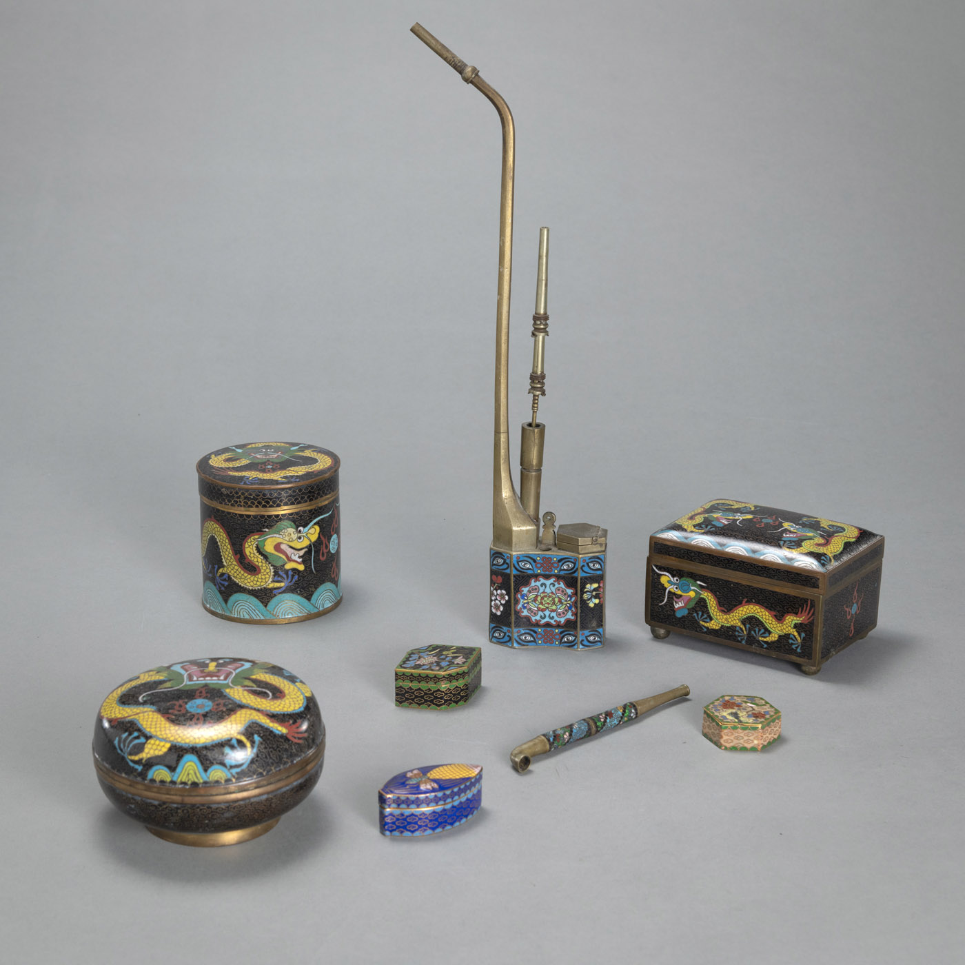 <b>A GROUP OF EIGHT CLOISONNÉ BOXES AND PIPES</b>
