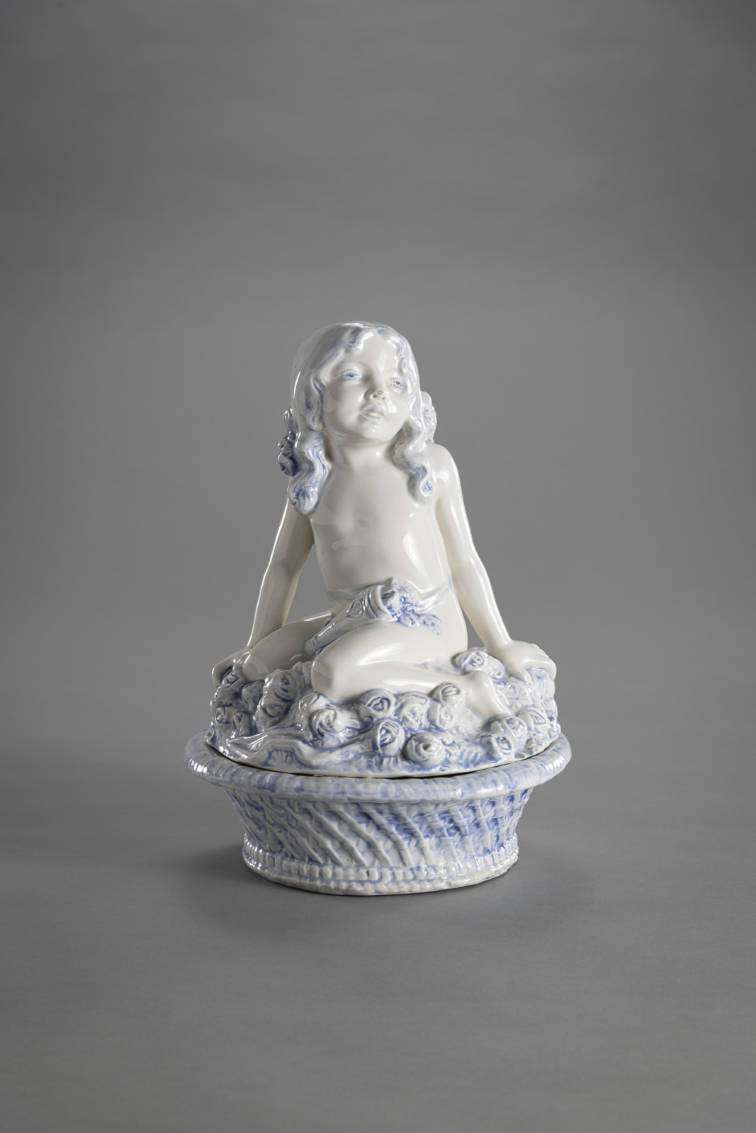 <b>A MAIOLICA BOWL AND LID WITH CUPID</b>