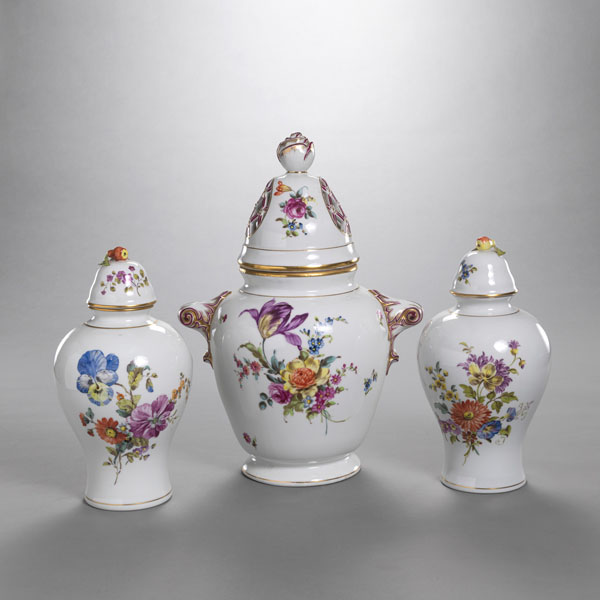 <b>THREE FLORAL TOOLED PORCELAIN VASES AND LIDS</b>