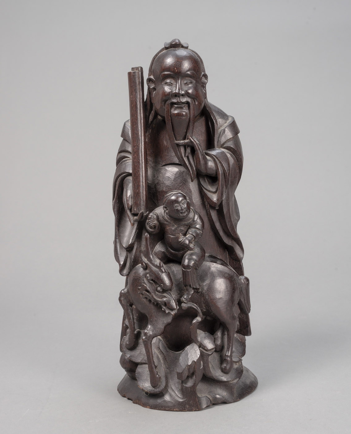 <b>A WOOD FIGURE OF 'LU' WITH A BOY RIDING A QILIN</b>