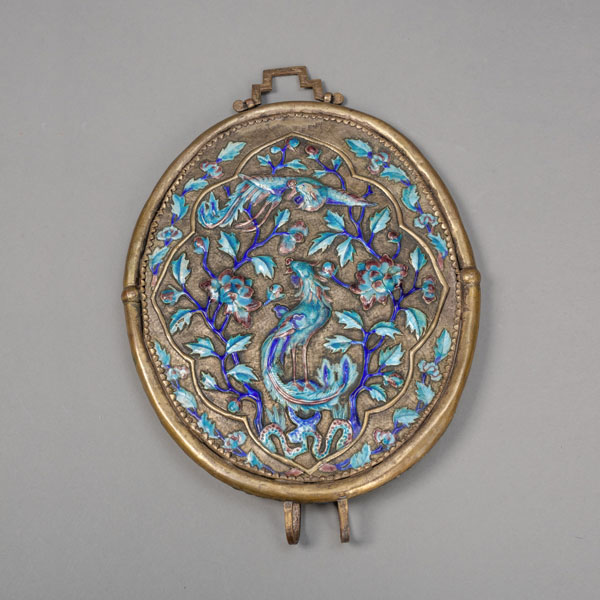 <b>AN OVAL MIRROR IN BLUE AND TURQUOISE ENAMELLED METAL MOUNT</b>