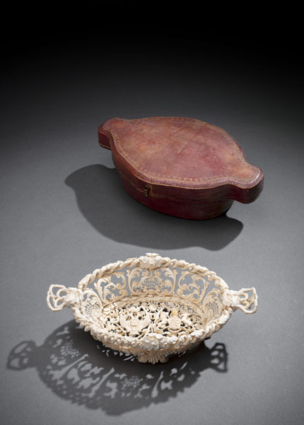 <b>AN ELABRORATE CARVED IVORY BASKET BOWL WITH THE ROYAL WÜRTTEMBERG AND THE RUSSIAN IMPERIAL BLAZONS</b>