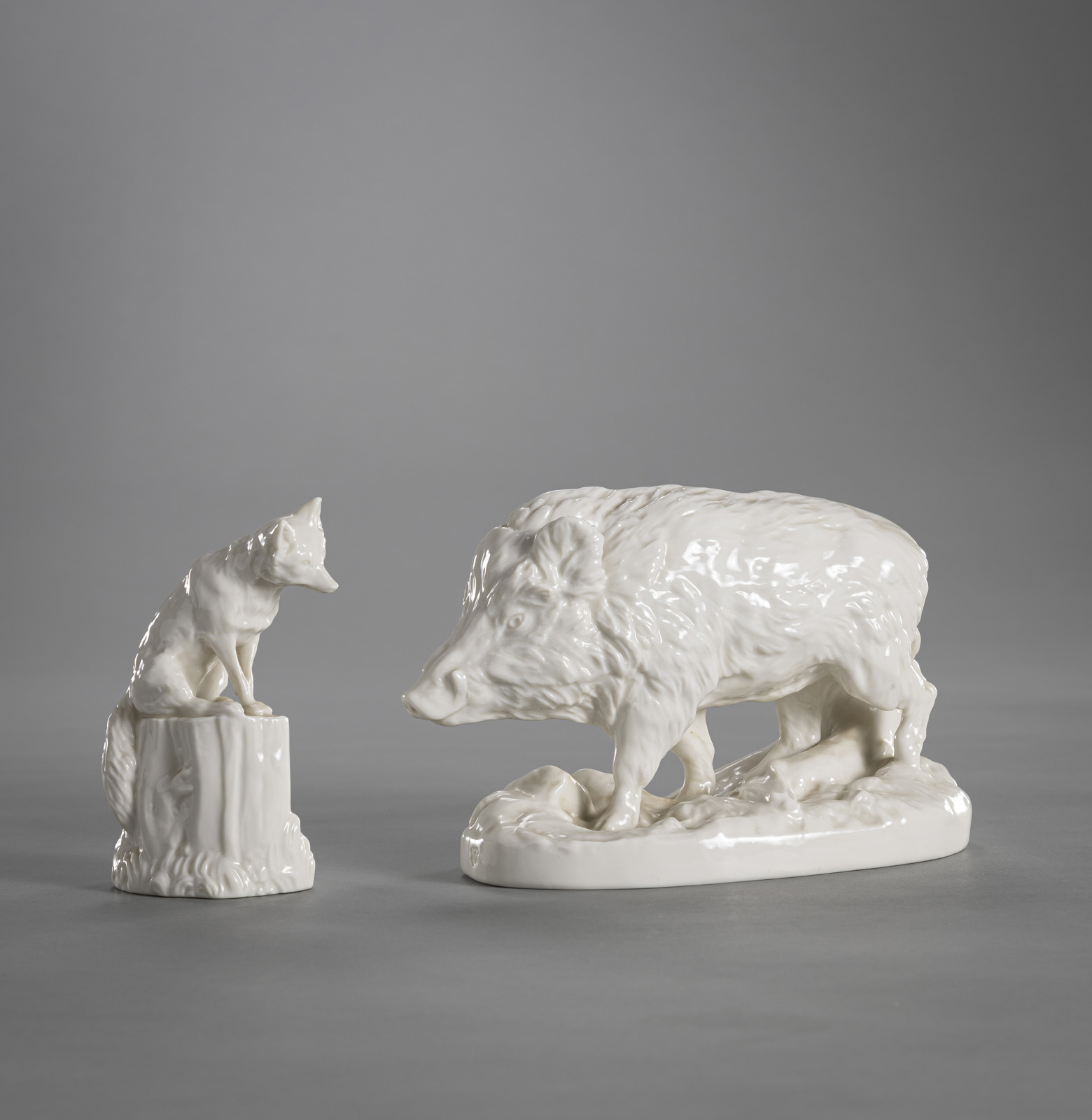 <b>A NYMPHENBURG FIGURE OF A WILD BOAR AND A FOX</b>