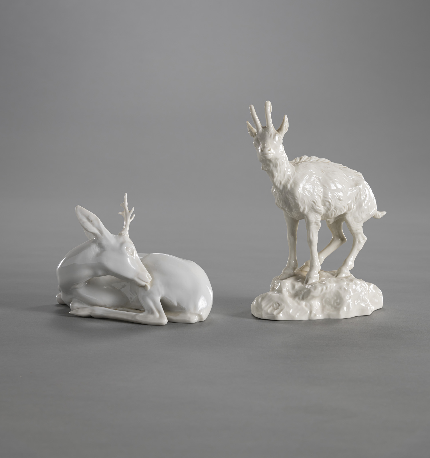 <b>A NYMPHENBURG WHITE PORCELAIN FIGURE OF A CHAMOIS AND A ROEBUCK</b>