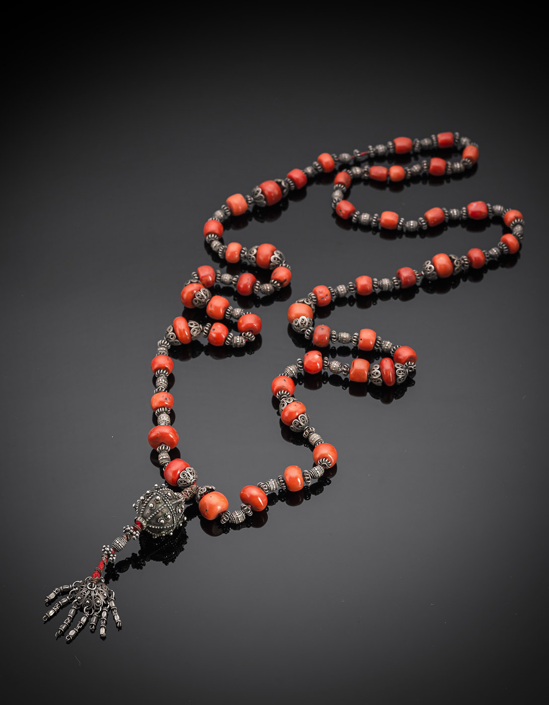<b>A  NECKLACE OF SILVER FILIGREE PEARLS AND CORAL BEADS</b>