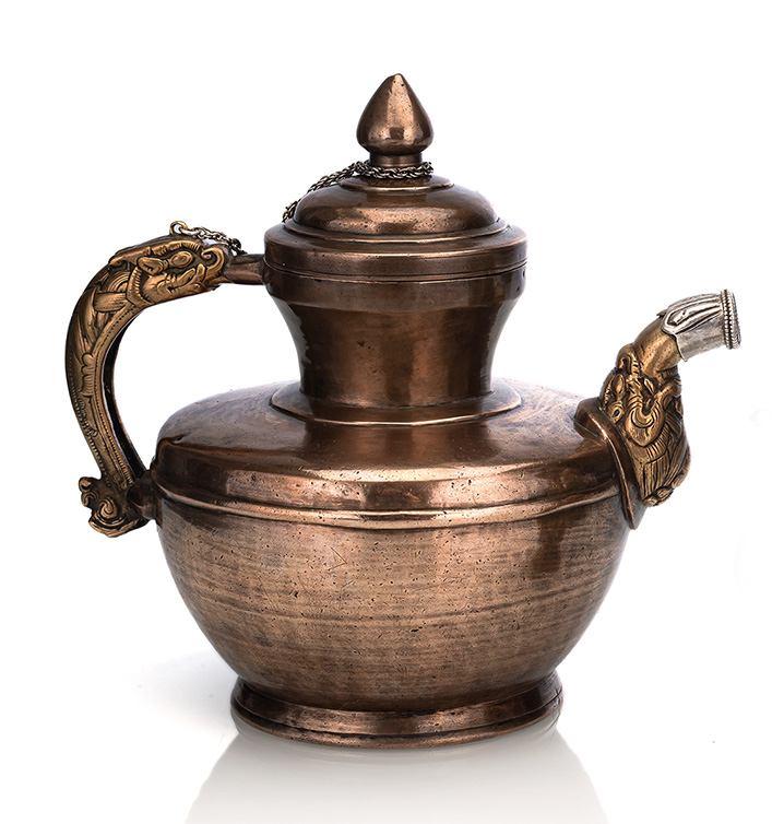 <b>A BRASS AND SILVER TEAPOT</b>