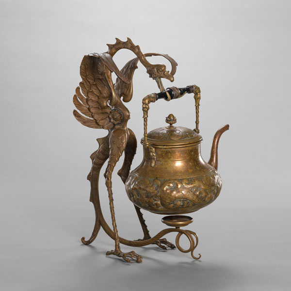 <b>A CHASED COPPER/METAL TEAPOT WITH DRAGON SHAPED STAND</b>