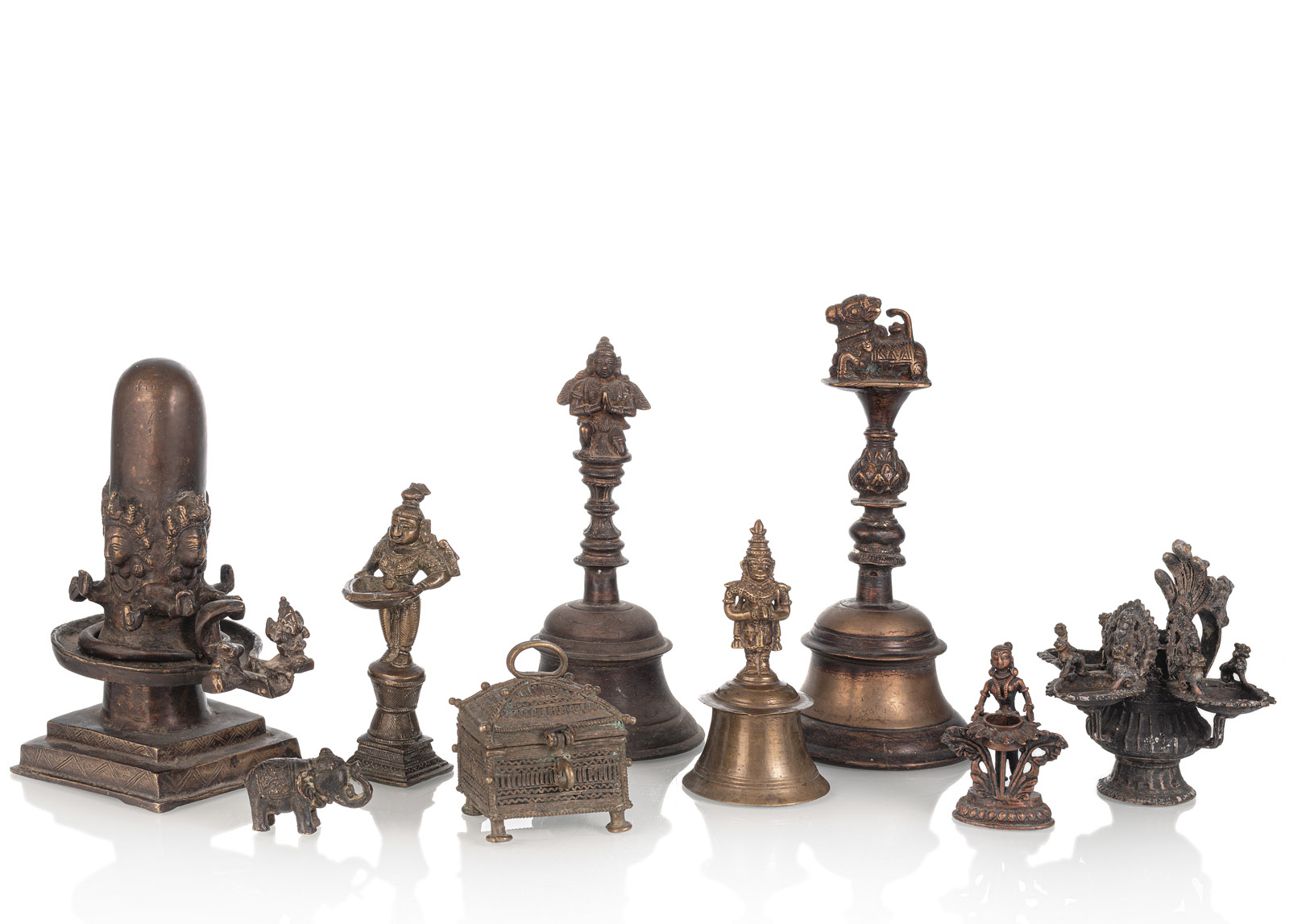 <b>A GROUP OF NINE BRONZE OBJECTS AMONG OTHERS A BRONZE BELLS, FIGURES, A HINGED BOX AND A LINGAM</b>