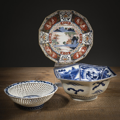 <b>TWO UNDERGLAZED BLUE BOWLS: ONE OPENWORKED WITH FLORAL DECORATION AND ONE HEXAGONAL WITH DRAGON DECORATION</b>