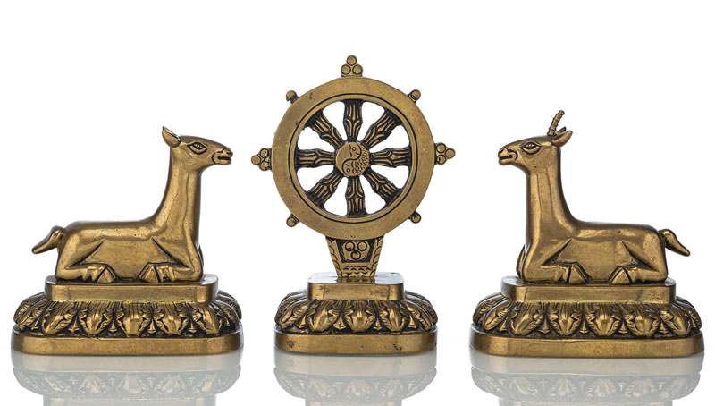 <b>A BRONZE SET COMPRISING OF A PAIR OF DEER FACING THE WHEEL OF DHARMA</b>