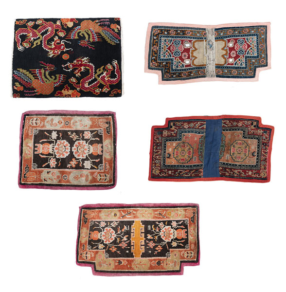 <b>THREE SADDLE COVERS AND TWO SEAT MATS WITH VARIOUS MOTIFS</b>