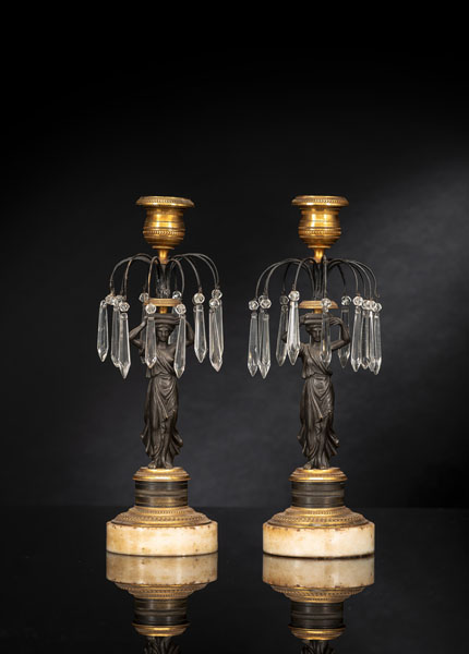 <b>A PAIR OF PARTIAL GILT AND PATINATED BRONZE CANDLESTICKS</b>