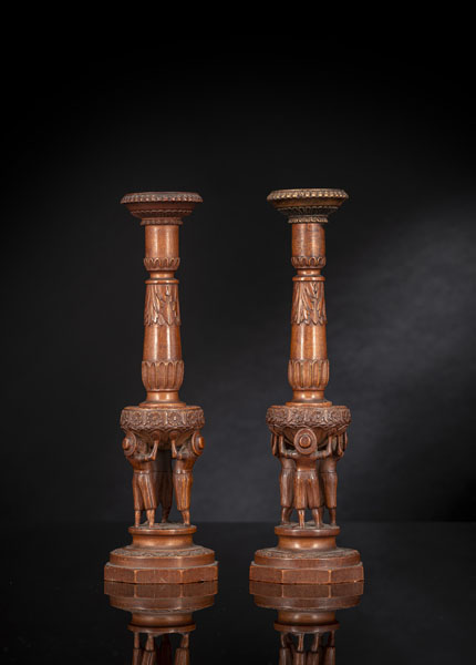 <b>A PAIR OF FIGURAL CARVED FRUITWOOD CANDLESTICKS</b>