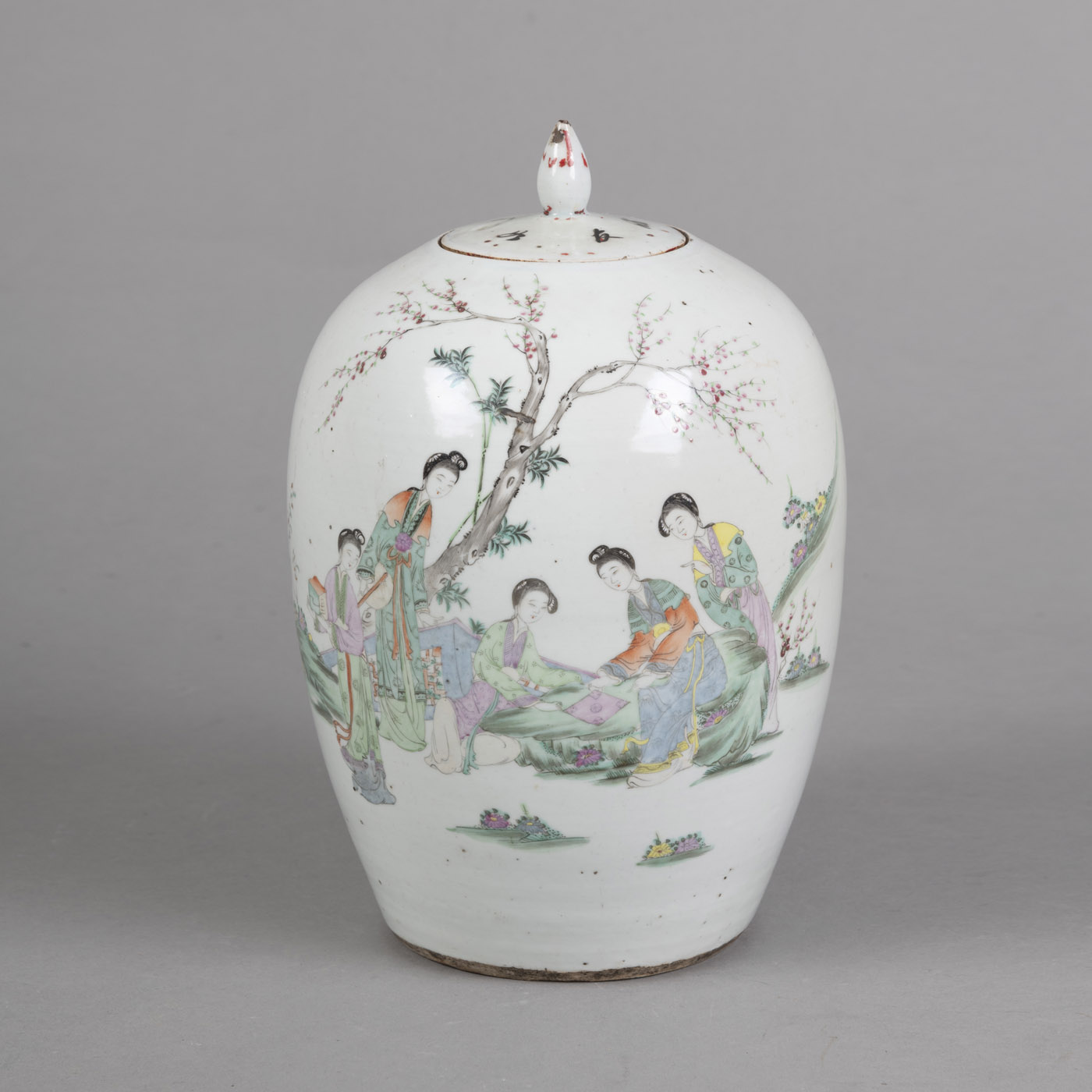<b>A POLYCHROME PAINTED PORCELAIN VASE AND COVER DEPICTING LADIES IN A GARDEN, ON THE RESERVE AN INSCRIPTION</b>