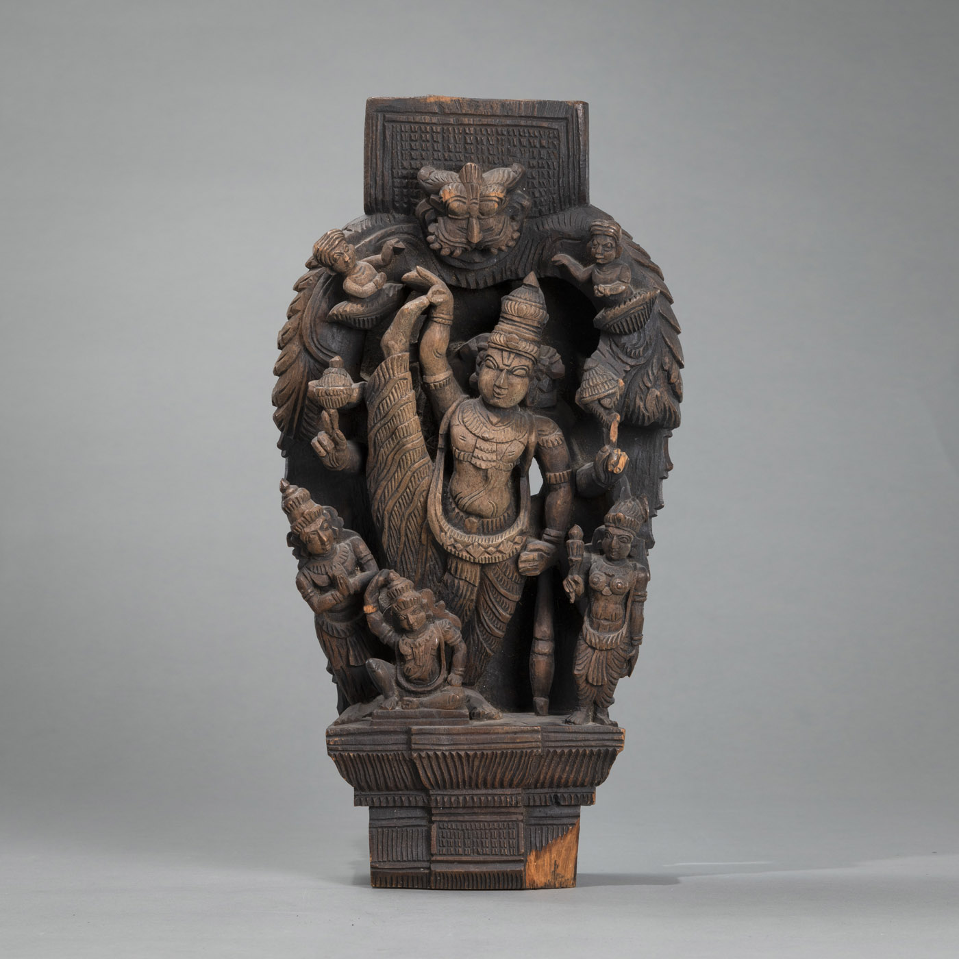 <b>A WOOD RELIEF CARVED WITH A HINDU DEITY AND ATTENDANTS</b>