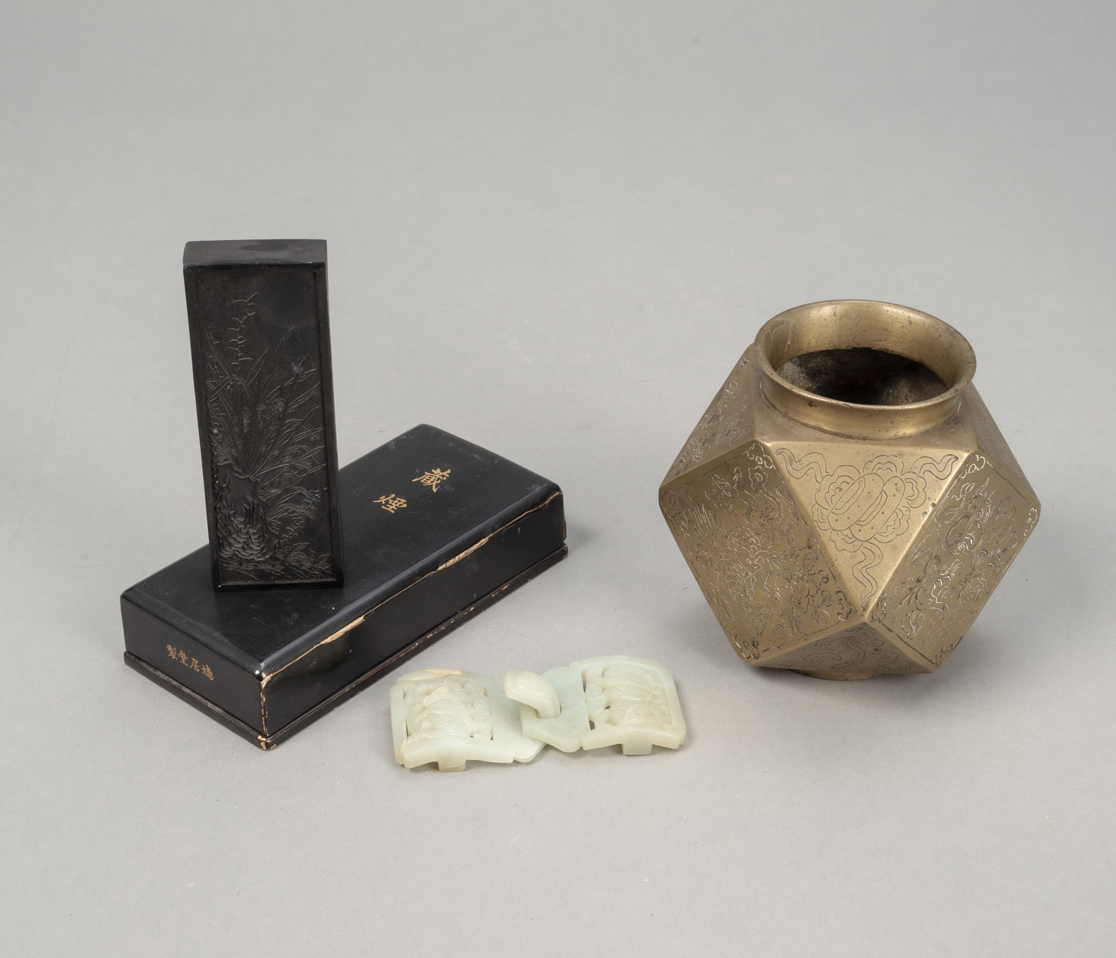 <b>A JADE BELT HOOK, A POLYGONAL BRASS VASE, AND AN INK STONE</b>