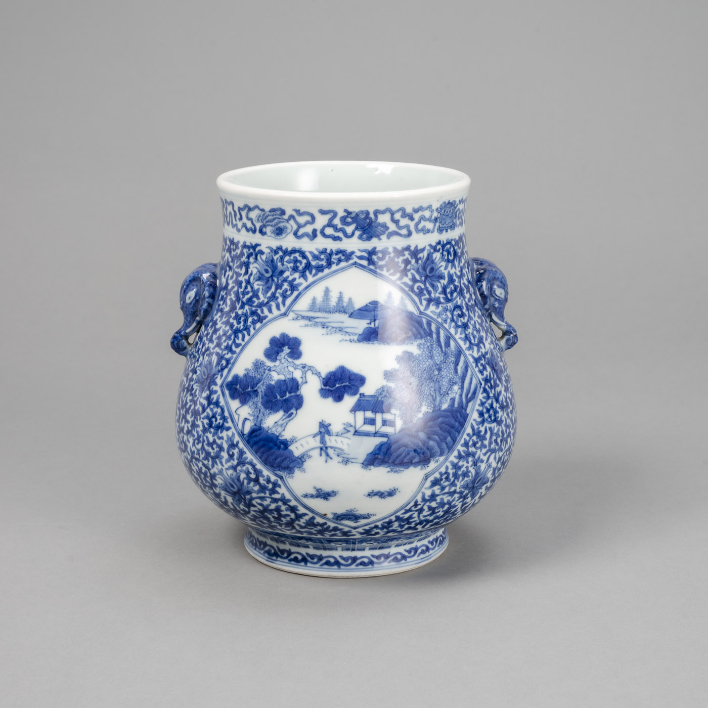 <b>A 'HU'-SHAPED BLUE AND WHITE LOTUS PORCELAIN VASE WITH ELEPHANT-HEAD HANDLES</b>