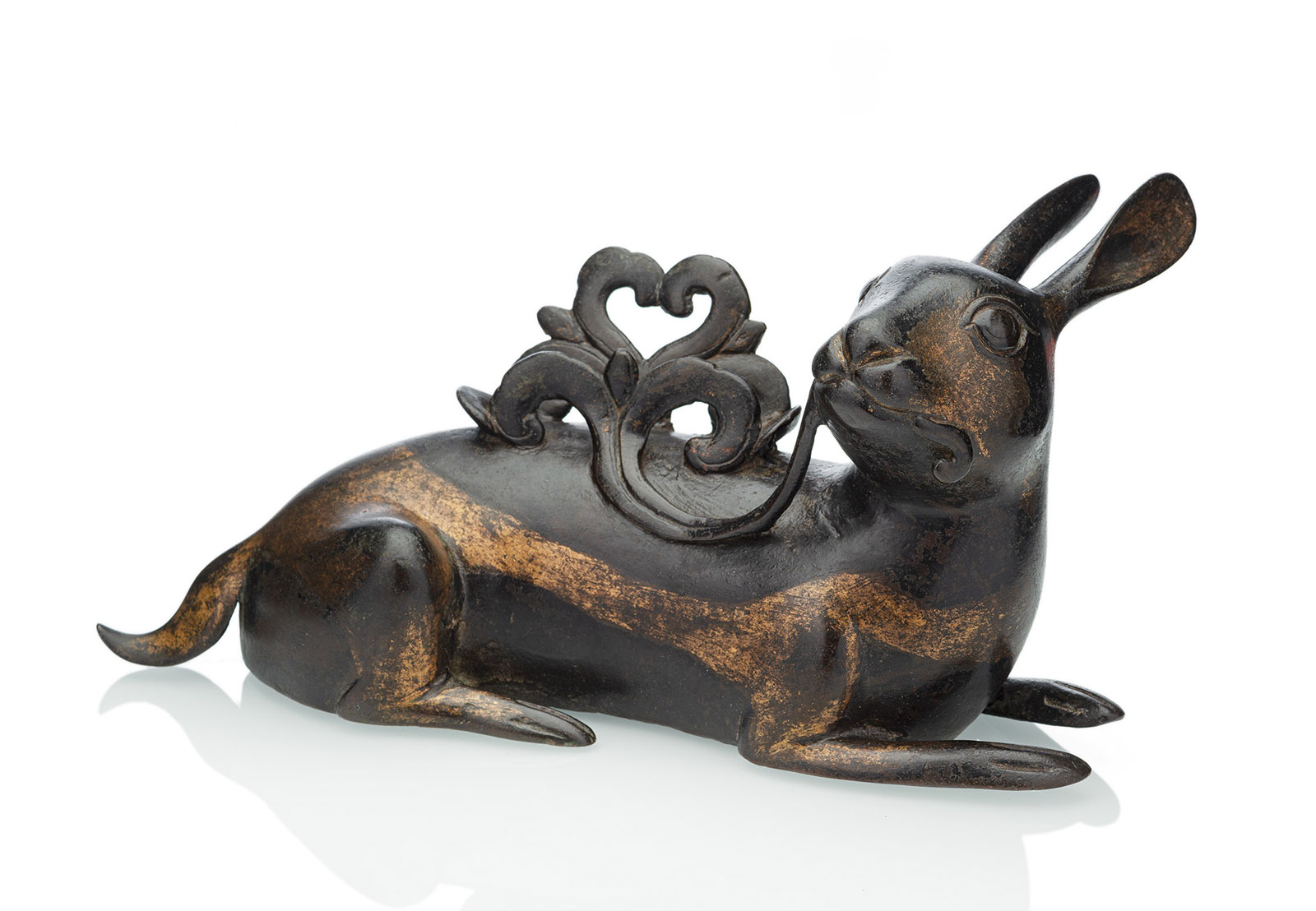 <b>A RARE PART-GILT BRONZE MIRROR HOLDER IN SHAPE OF A RECUMBENT HARE</b>