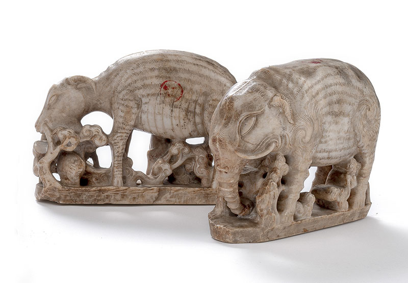 <b>A PAIR OF WHITE STONE CARVINGS OF AN ELEPHANT AND A DEER WITH LINGZHI AT THE BASE</b>