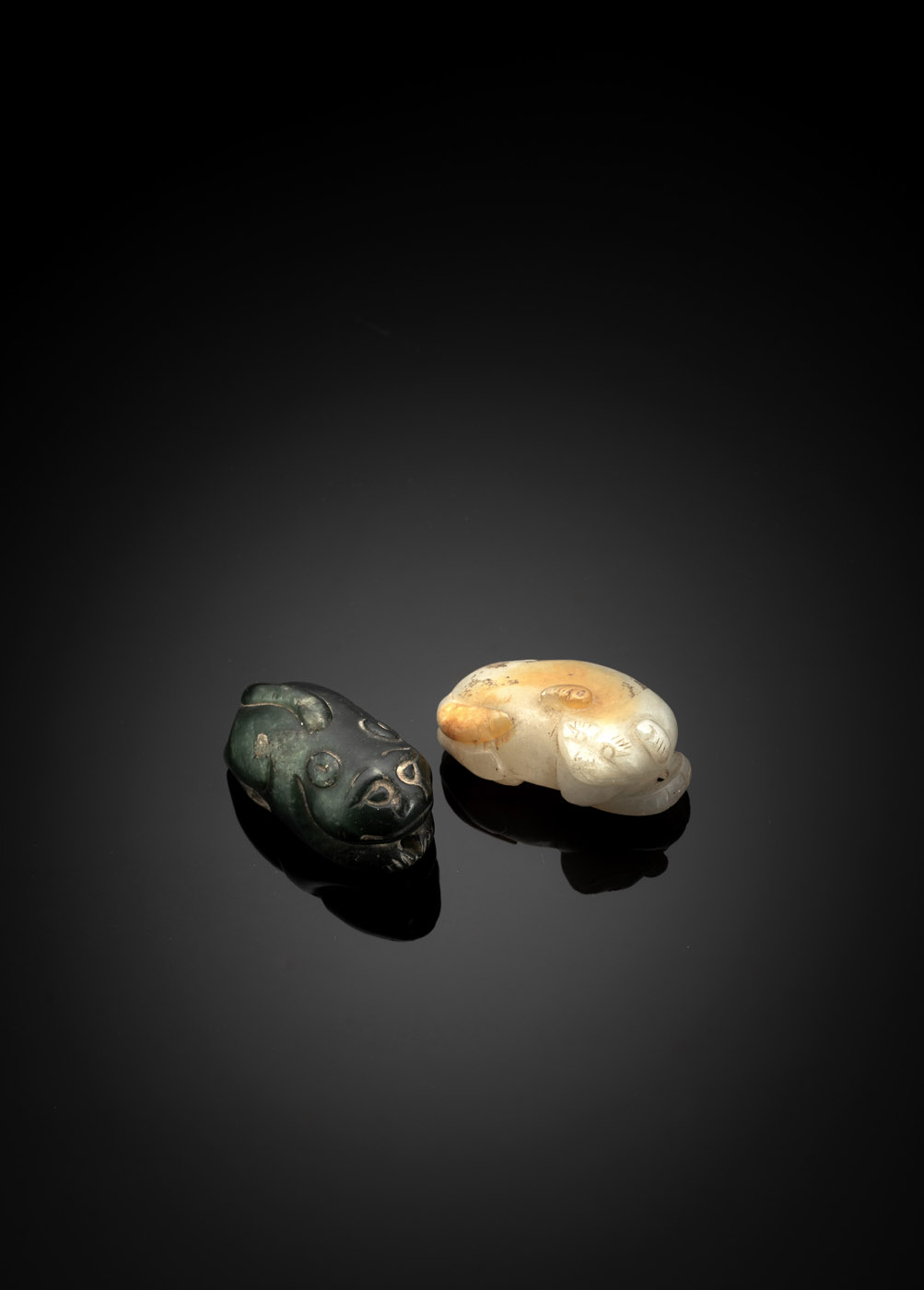 <b>A JADE CARVING OF A CAT AND A RECUMBENT MYTHICAL ANIMAL AND A CARVING</b>