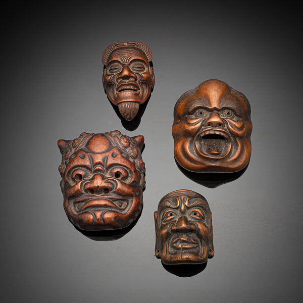 <b>Vier Masken-Netsuke aus Holz</b>
