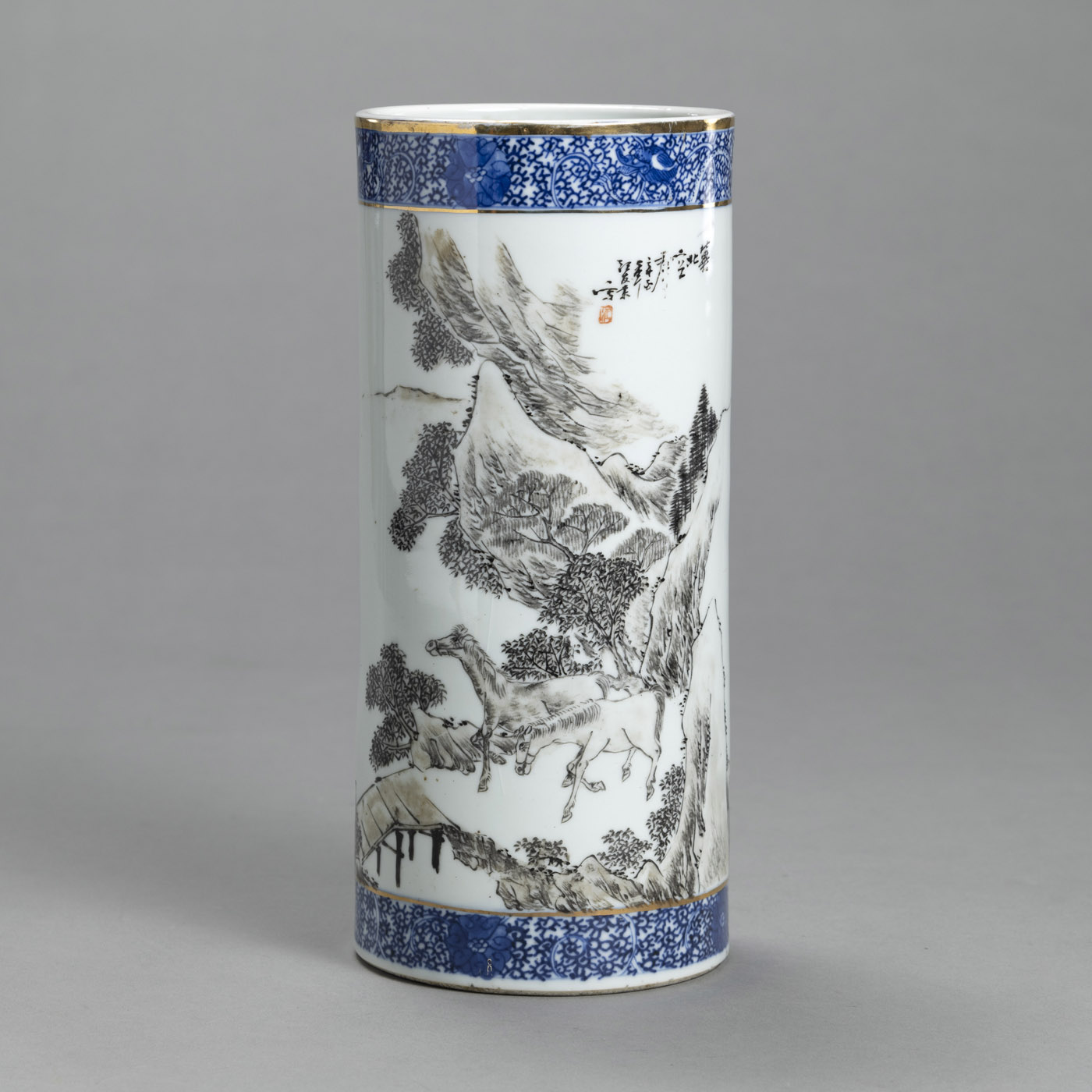<b>A CYLINDRICAL PORCELAIN HAT STAND WITH GRISAILLE PAINTED  LANDSCAPE WITH TWO HORSES</b>