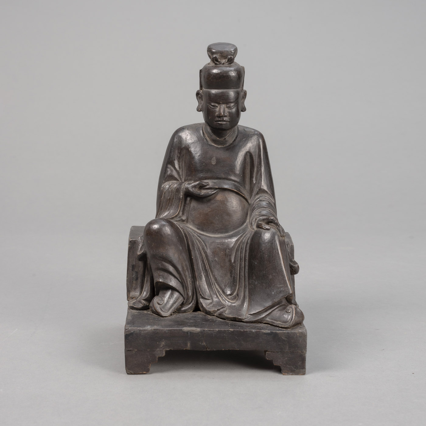 <b>A LACQURED WOOD SCULPTURE OF A SEATED DIGNITARY</b>