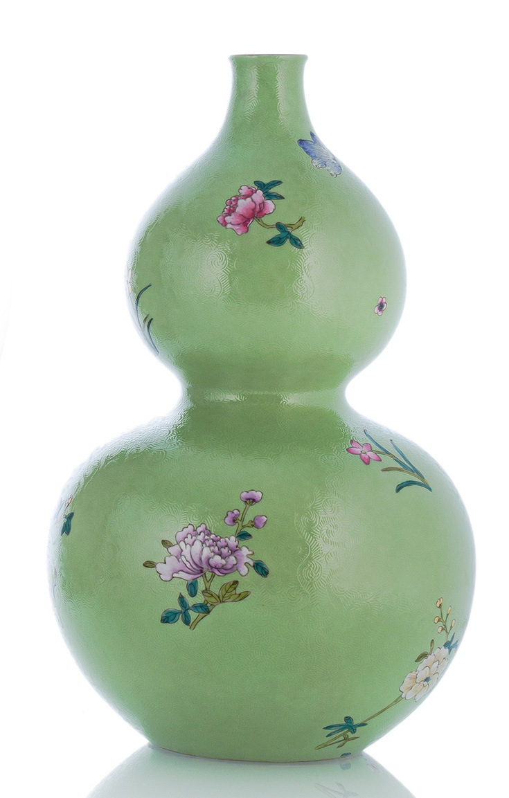 <b>A SCRAFFIATO LIME-GREEN GROUND 'FAMILLE ROSE' FLORAL DOUBLE-GROUD PORCELAIN VASE</b>