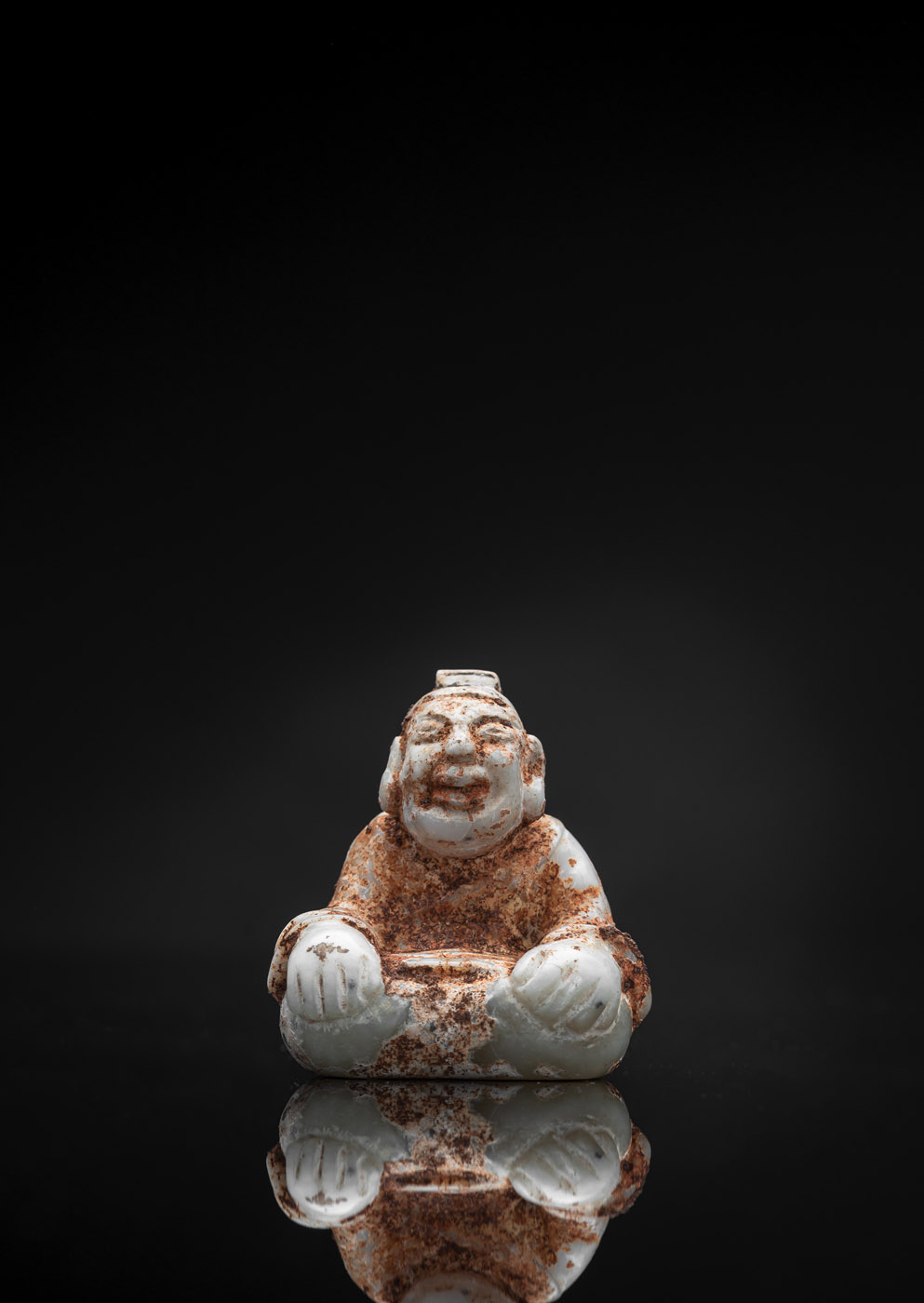 <b>A VERY RARE CALCIFIED JADE FIGURE OF A SEATED MAN</b>