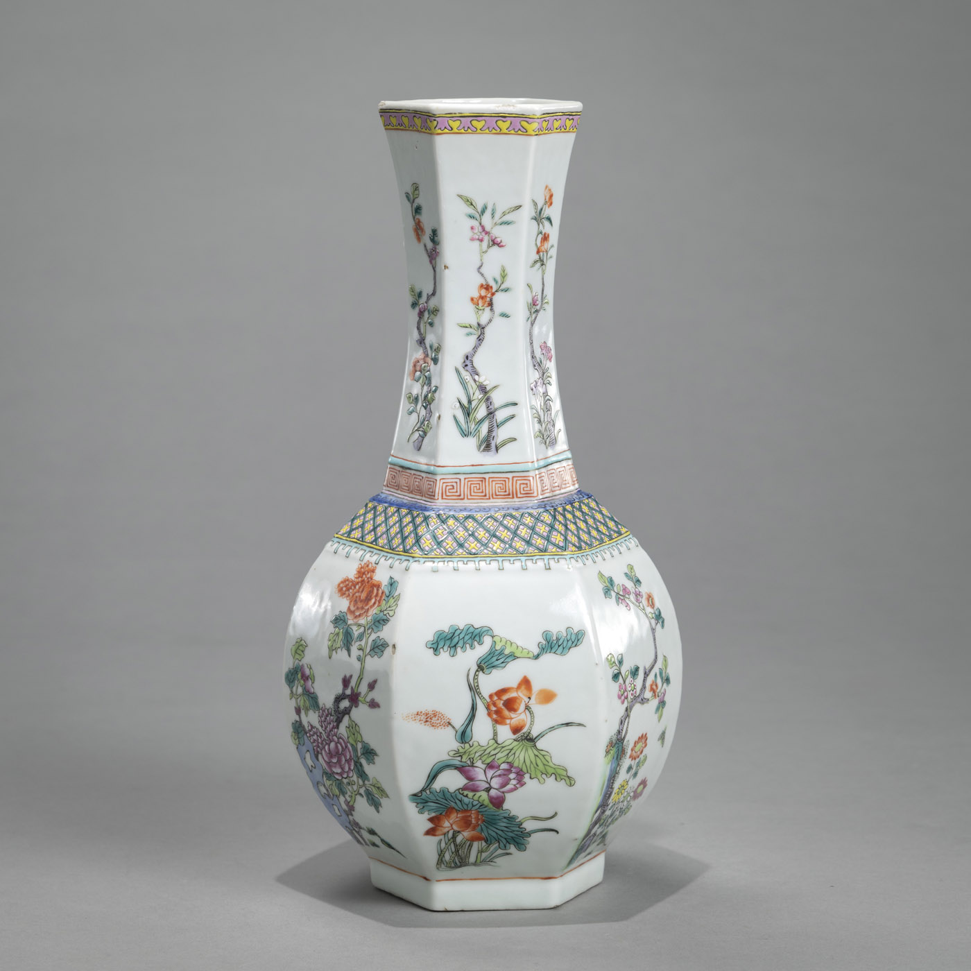 <b>A HEXAGONAL 'FAMILLE ROSE' VASE DEPICTING FLOWERS OF THE FOUR SEASONS</b>