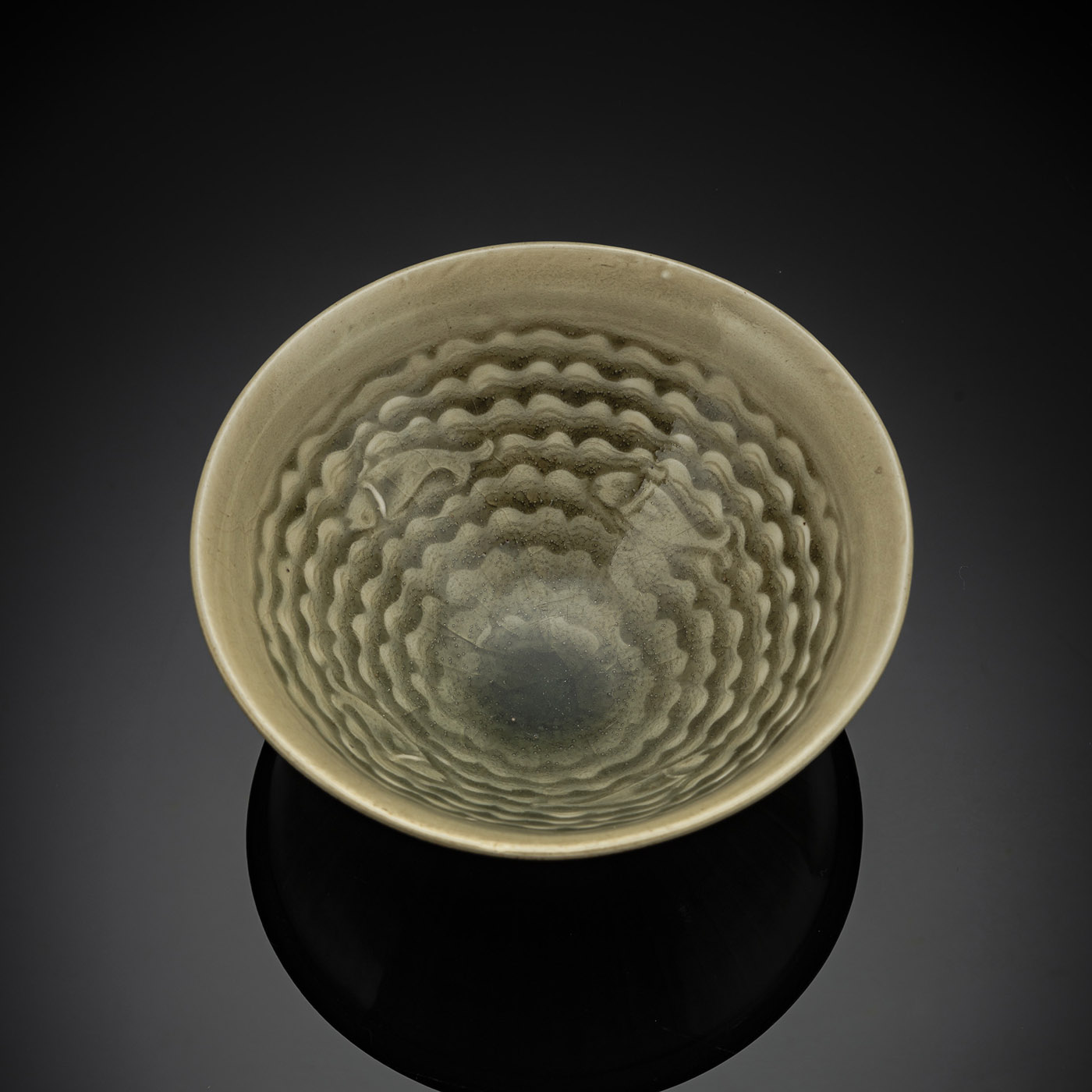 <b>A FINE 'YAOZHOU' CELADON MOLDED 'FISH' BOWL</b>