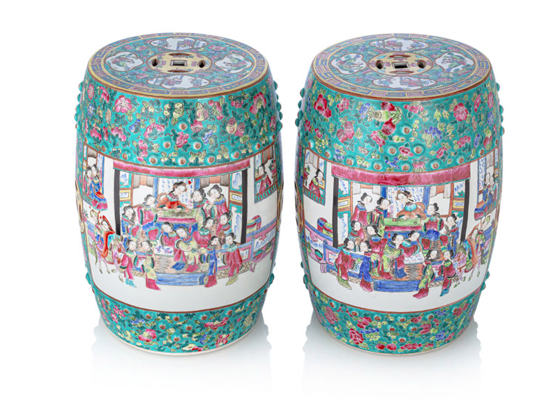 <b>A PAIR OF 'FAMILLE VERTE' PORCELAIN GARDEN STOOLS DEPICTING LADIES DOING VARIOUS ACTIVITES IN RESERVES ON A FLORAL BACKGROUND WITH BATS AND CASH COINS</b>