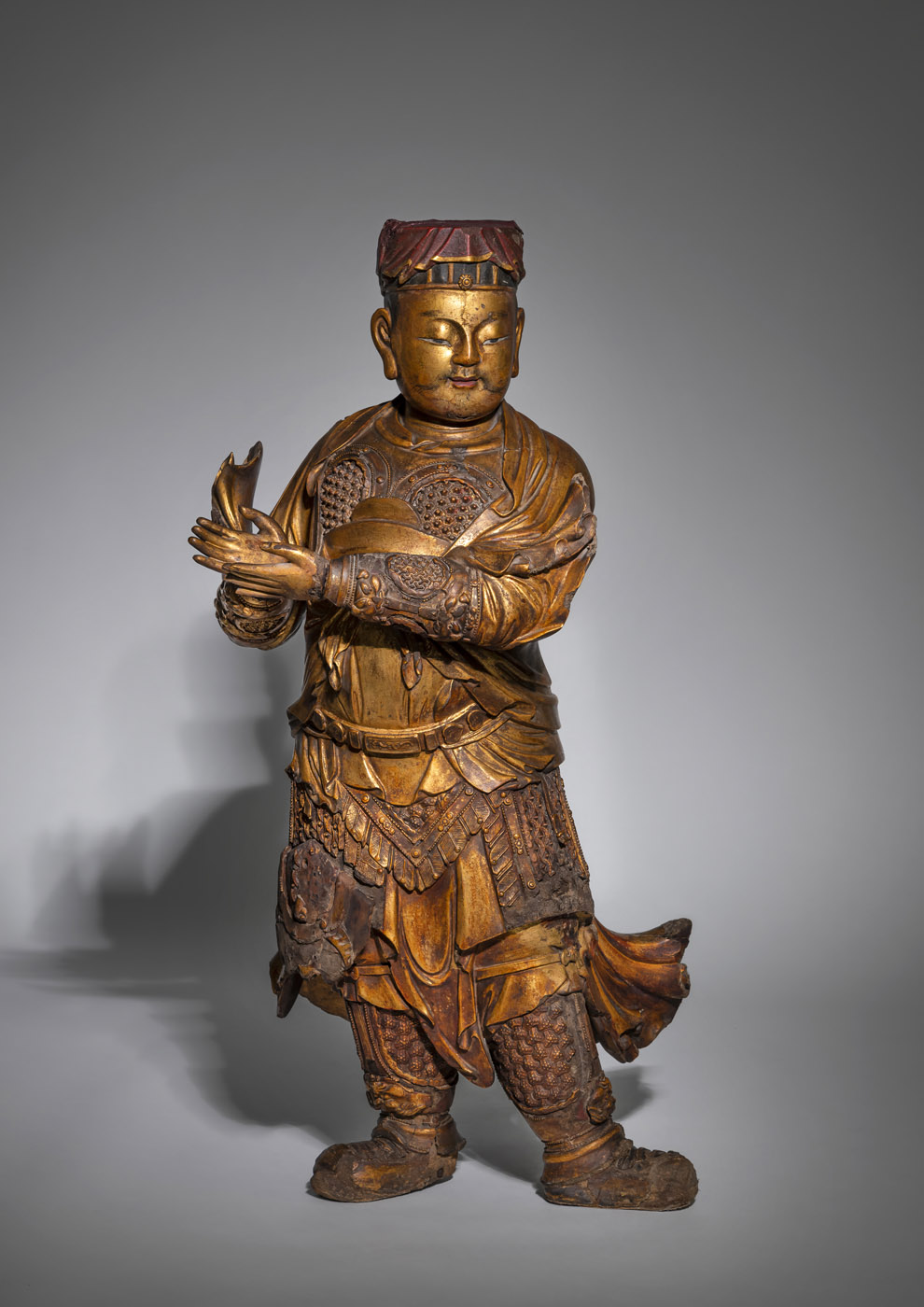 <b>A  FINE AND LARGE GILT- AND RED-LACQUERED WOOD FIGURE OF GUAN PING</b>