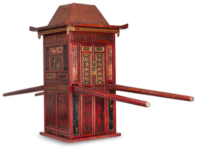 <b>A WOODEN WEDDING LITTER FOR A BRIDE, RED LACQUERED, RICHLY ORNAMENTED AND GILDED, THE BAMBOO ROOF REMOVABLE, FOUR CARRYING RODS</b>