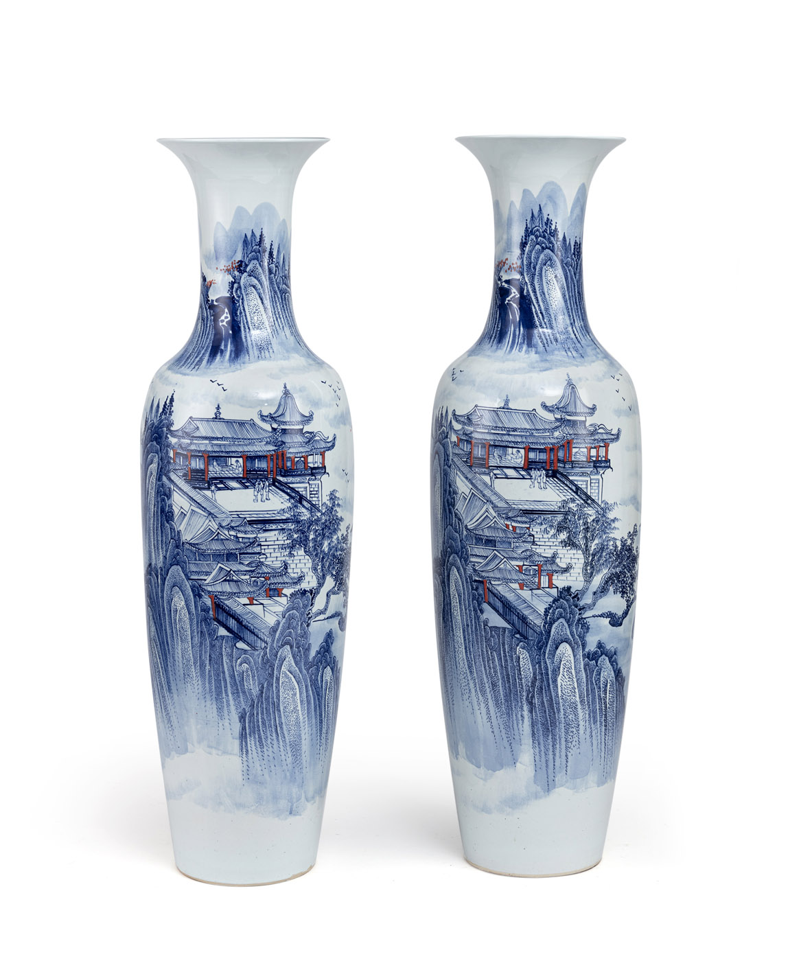 <b>A PAIR OF LARGE PORCELAIN FLOOR VASES DEPICTING A MOUNTAIN LANDSCAPE WITH PALACES AND FIGURES</b>