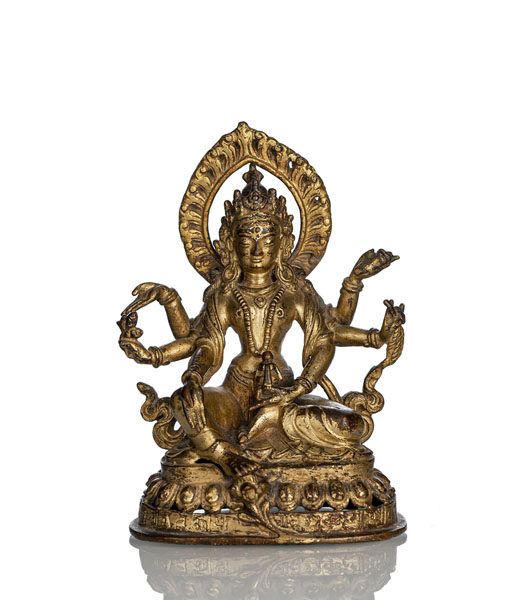 <b>A GILT-BRONZE FIGURE OF VASUDHARA SEATED ON A INSCRIBED LOTUS THRONE</b>