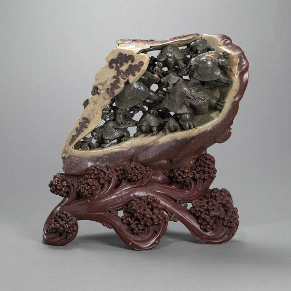 <b>A LARGE SOAPSTONE CARVING DEPICTING NINE DRAGONS (BA XIA) IN A ROCK CAVE ON WAVES, SURROUNDED BY BATS</b>