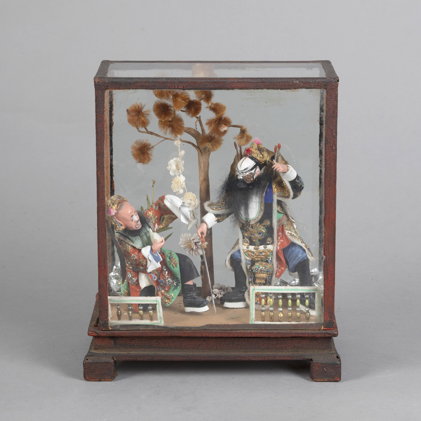 <b>A GLASS SHOWCASE WITH TWO PAINTED CERAMICS PEKING OPERA FIGURES</b>