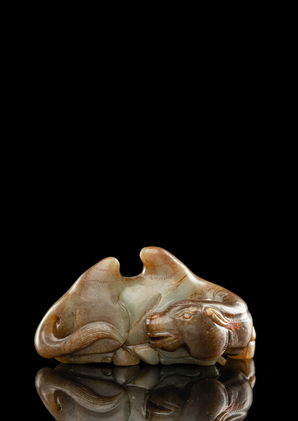 <b>A WELL CARVED JADE MODEL OF A RECUMBENT BACTRIAN CAMEL</b>