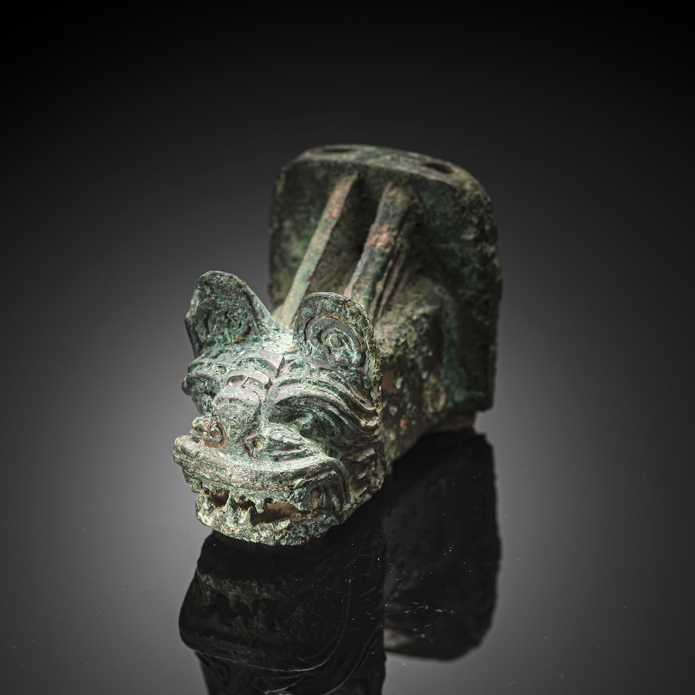 <b>A BRONZE FITTING WITH A TIGER HEAD</b>